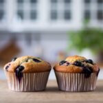 "Breakfast table with blueberry muffins and coffee."