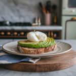 "Step-by-step process for making avocado toast with poached egg: mashing avocado, poaching an egg, and assembling the toast."